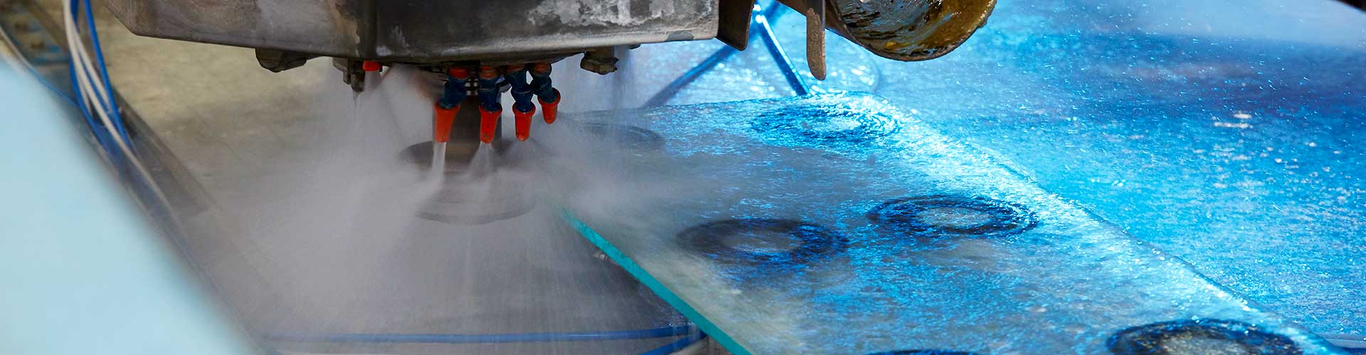 Automated machine polishing glass edges at abc Glass Processing